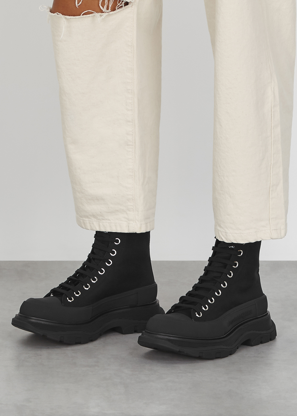 Alexander McQueen Tread black canvas hi-top sneakers - Harvey Nichols