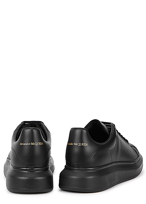 emulsion Surichinmoi Spædbarn Alexander McQueen Oversized black leather sneakers - Harvey Nichols