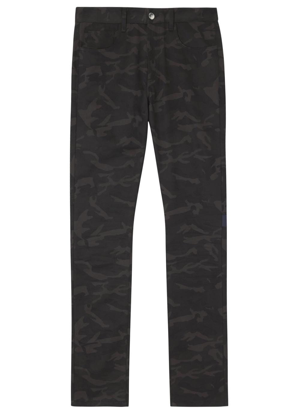 X Sterling Ruby black camouflage print jeans